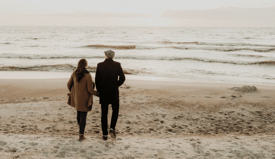 Married-Couple-Walking-in-Beach