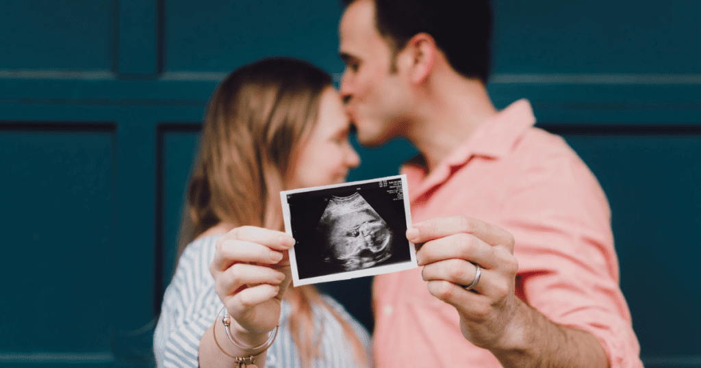 Happy couple having a baby