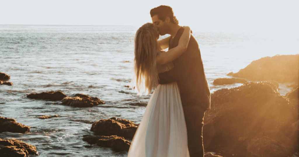 couple-kissing-beach-married